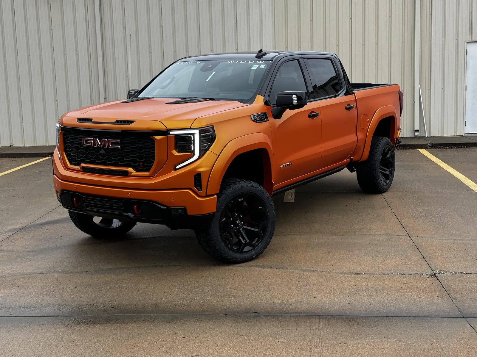 Gloss orange lifted GMC Sierra AT4
